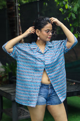 “Tarang handblock printed unisex shirt featuring intricate floral patterns on a soft, breathable fabric. Ideal for casual outings and crafted with sustainable materials.”