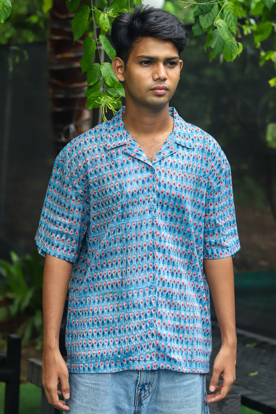 “Tarang handblock printed unisex shirt featuring intricate floral patterns on a soft, breathable fabric. Ideal for casual outings and crafted with sustainable materials.”