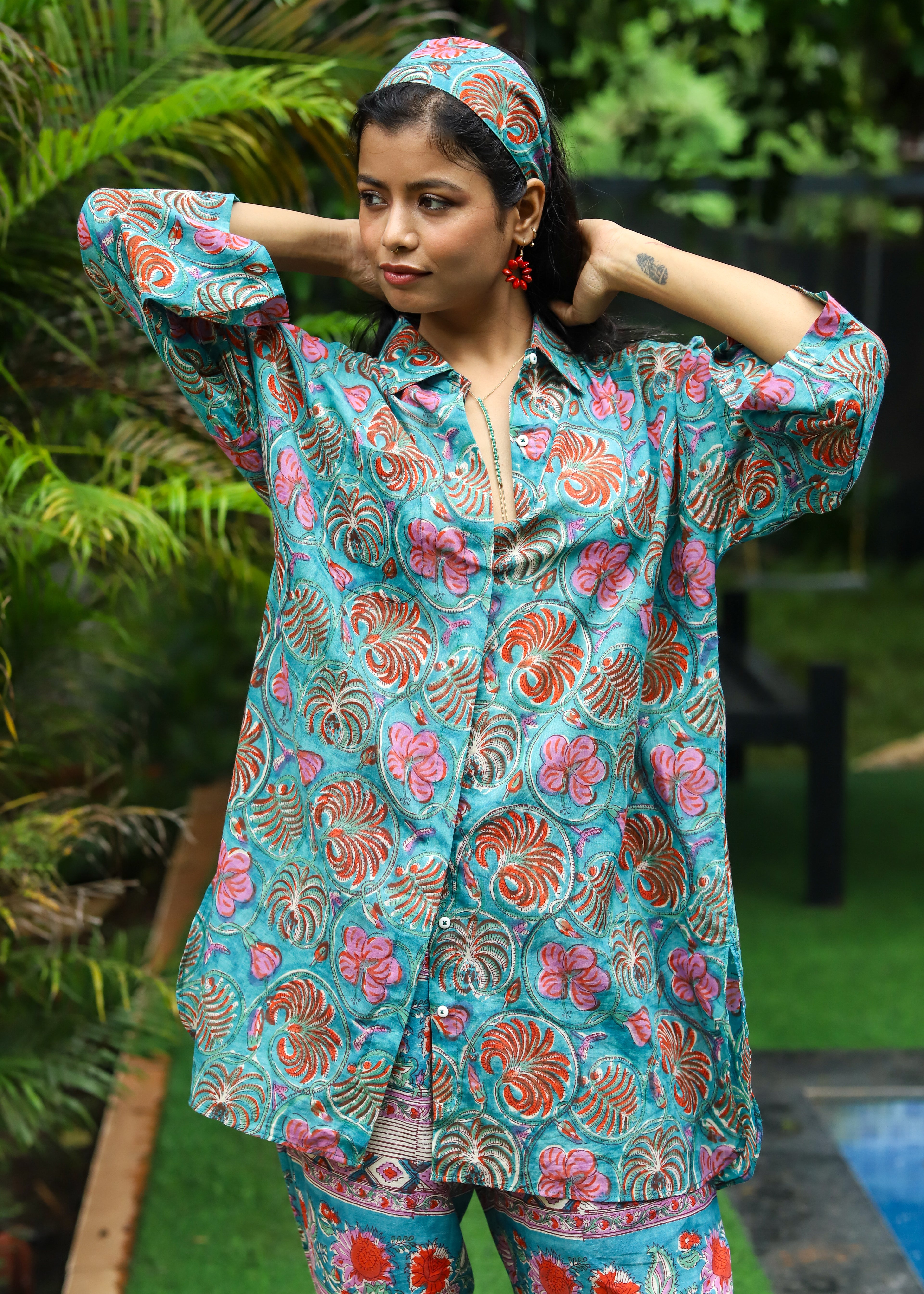 “Set of 2 Parwan tunic shirt and palazzos with matching headband, featuring handblock floral print in lightweight fabric, ideal for casual and festive wear.”