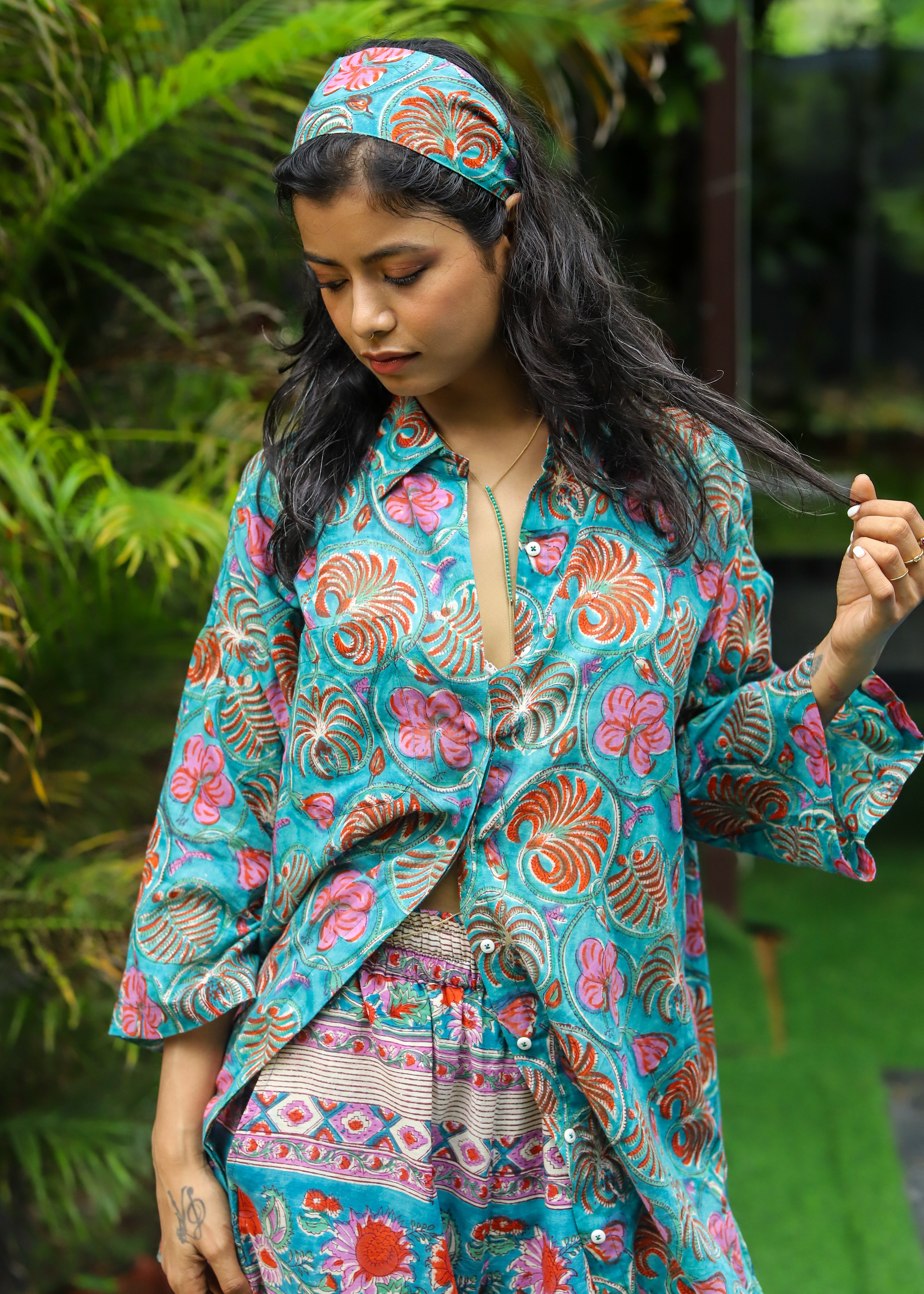 “Set of 2 Parwan tunic shirt and palazzos with matching headband, featuring handblock floral print in lightweight fabric, ideal for casual and festive wear.”