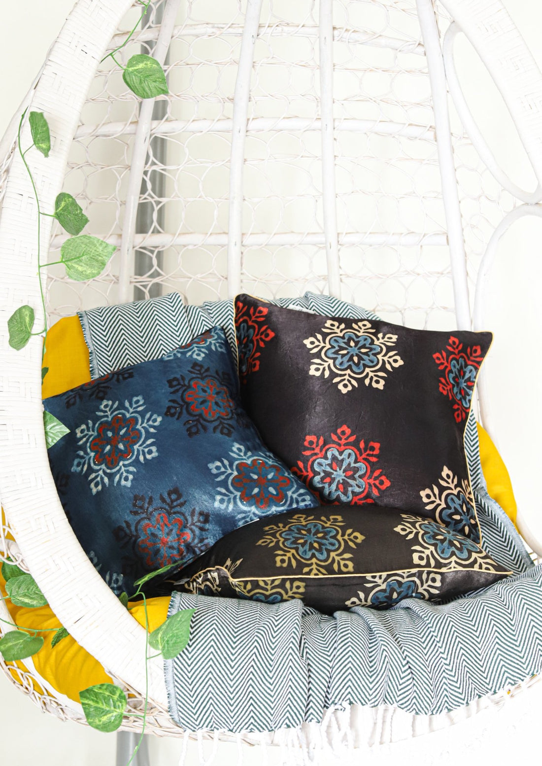 Ajrakh block printed cushion cover in vibrant colors featuring intricate patterns, made from soft Mashru fabric, measuring 16x16 inches. Perfect for adding a touch of ethnic charm to any space.