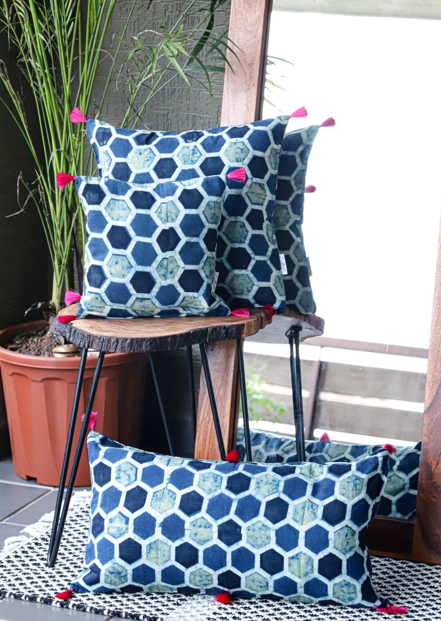 MADHUKOSH - Set of 3 Ajrakh Block Printed Indigo Cushion Covers in sizes 11x11, 16x16, and 22x12, featuring traditional handblock prints in deep indigo tones.