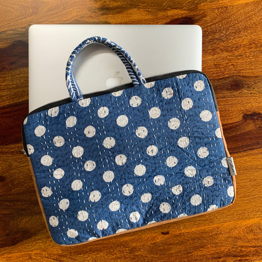 &quot;Indigo laptop bag with Dabu handblock print, featuring intricate patterns and sturdy handles for a stylish and functional design.&quot;