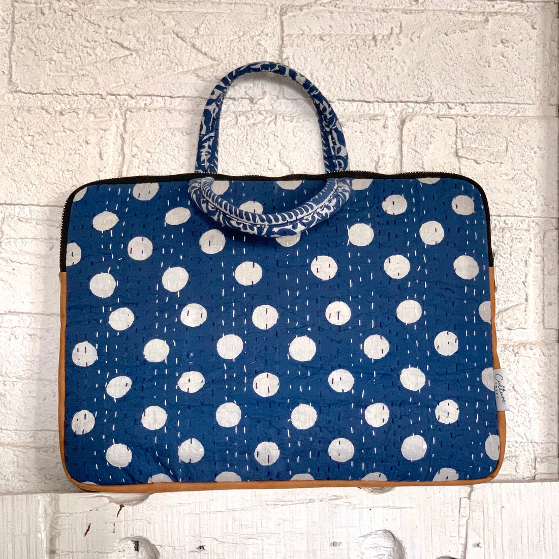 &quot;Indigo laptop bag with Dabu handblock print, featuring intricate patterns and sturdy handles for a stylish and functional design.&quot;