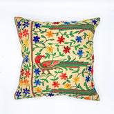 "16x16 inch cushion cover featuring vibrant block printed patterns and intricate hand embroidery, adding a touch of artisanal charm to any space."