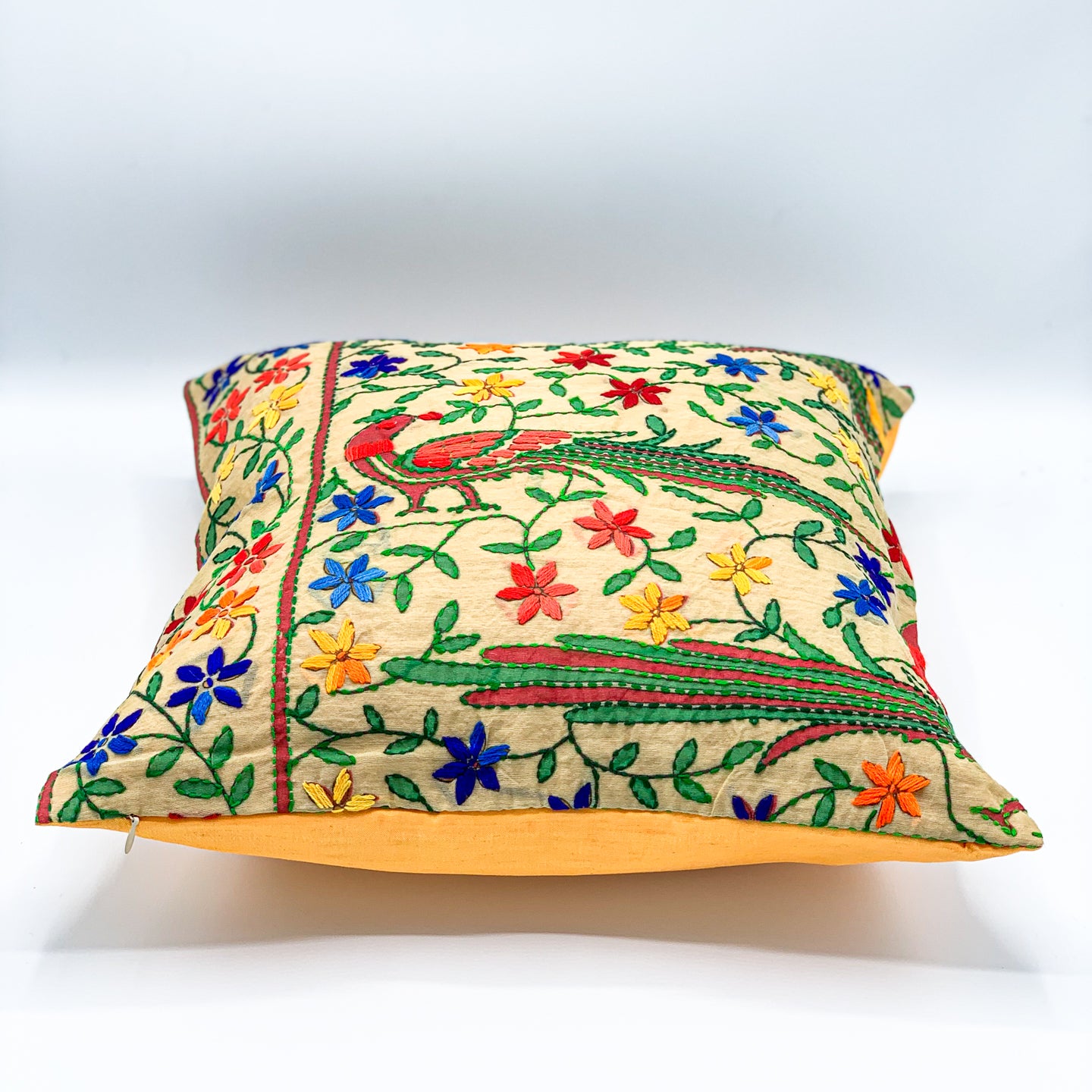 &quot;16x16 inch cushion cover featuring vibrant block printed patterns and intricate hand embroidery, adding a touch of artisanal charm to any space.&quot;