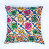 "Block printed and hand embroidered cushion cover in 18x18 size featuring intricate floral designs and vibrant colors, perfect for adding a touch of artistry to your home decor."