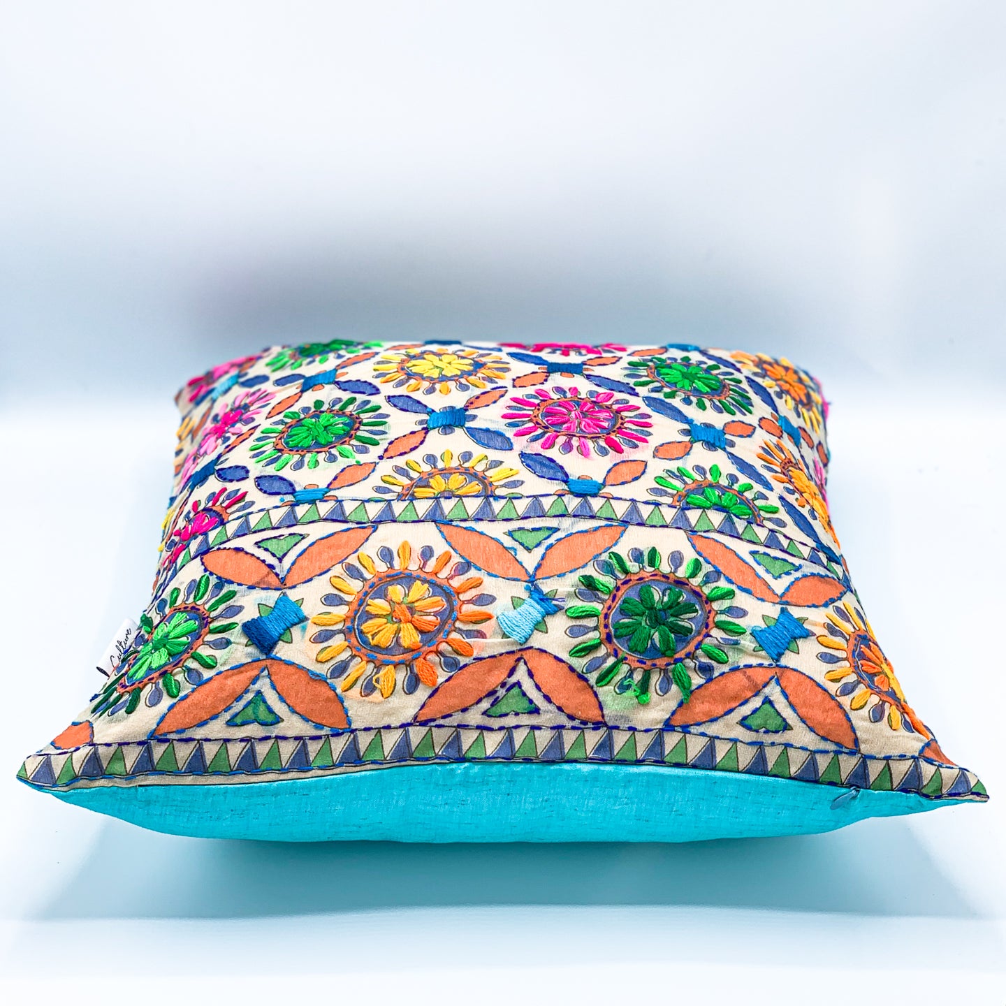 &quot;Block printed and hand embroidered cushion cover in 18x18 size featuring intricate floral designs and vibrant colors, perfect for adding a touch of artistry to your home decor.&quot;