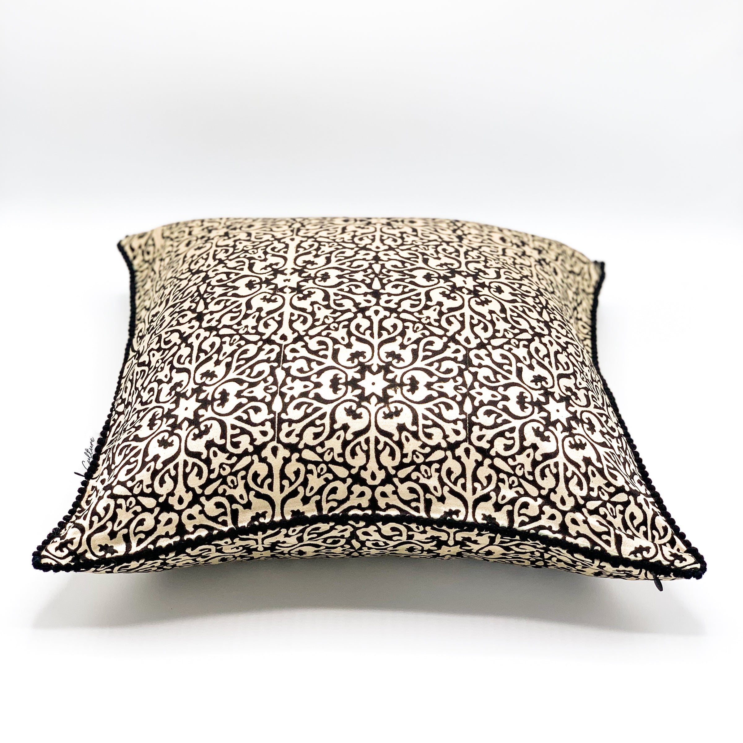 NOOR Ajrakh block-printed mashru cushion cover in rich, earthy tones featuring intricate patterns, available in sizes 16x16 inches and 18x18 inches. Perfect for adding a touch of elegance and cultural charm to your home decor