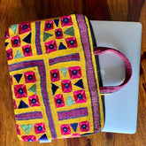 "ABHLA - Vintage Kutch Embroidery Laptop Bag with intricate, vibrant traditional designs, showcasing handcrafted details and cultural artistry."